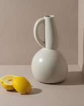 handmade, artisan made, jug, pitcher, bottle, blanc mat, matte finish, serveware, drinkware, pichet, bouteille, carafe, blanc mat, artisan made fait à la main, arisanal, intemporel, design, gharyan stoneware, ethically made, ethique, fair trade, commerce équitable