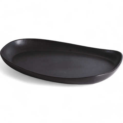 Matte black stoneware serving platter displayed on a clean white background, highlighting its smooth finish and minimalistic, handcrafted design.